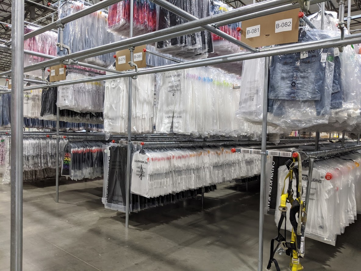 UDS GOH speed rails — garments polybagged and ready for retail distribution
